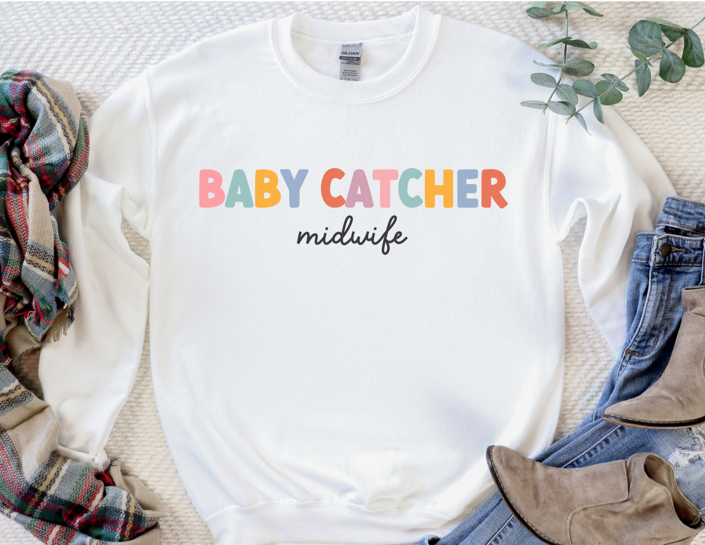 white "baby catcher" midwife sweatshirt with colorful letters