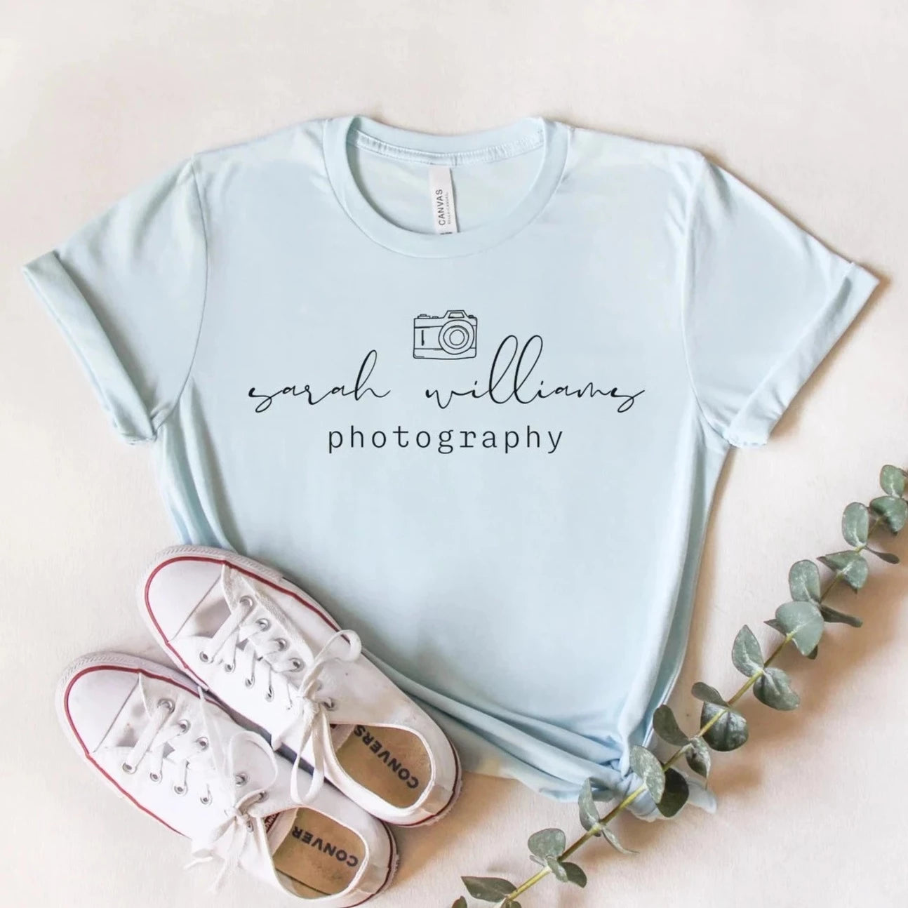 custom photographer t-shirt with camera icon in light blue