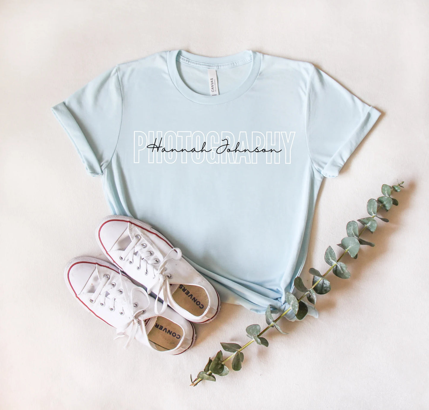 light blue custom photographer t-shirt with block and cursive text