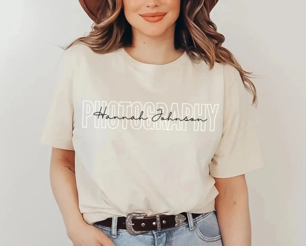 tan colored custom photographer t-shirt with block and cursive text