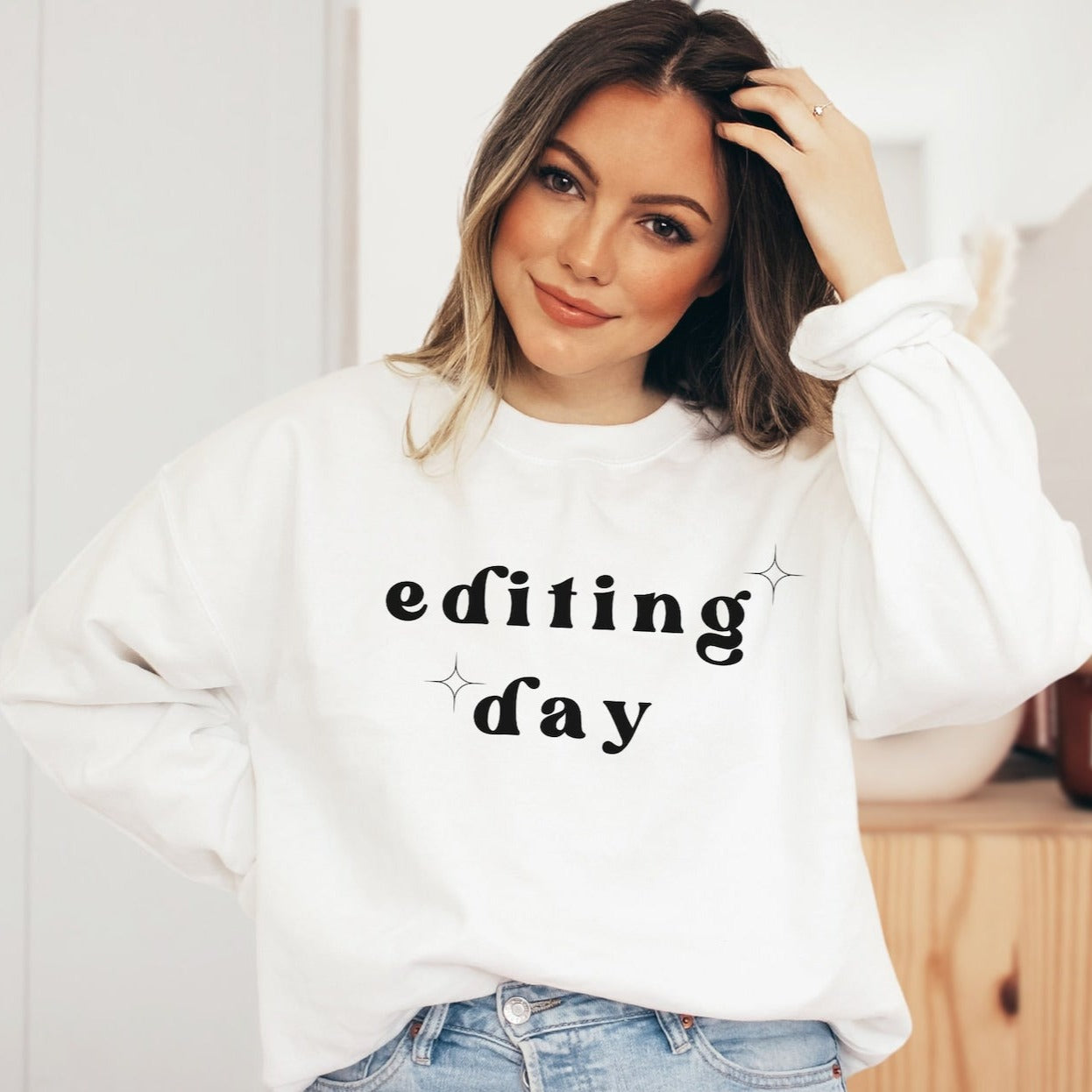 white "editing day" sweatshirt with retro text