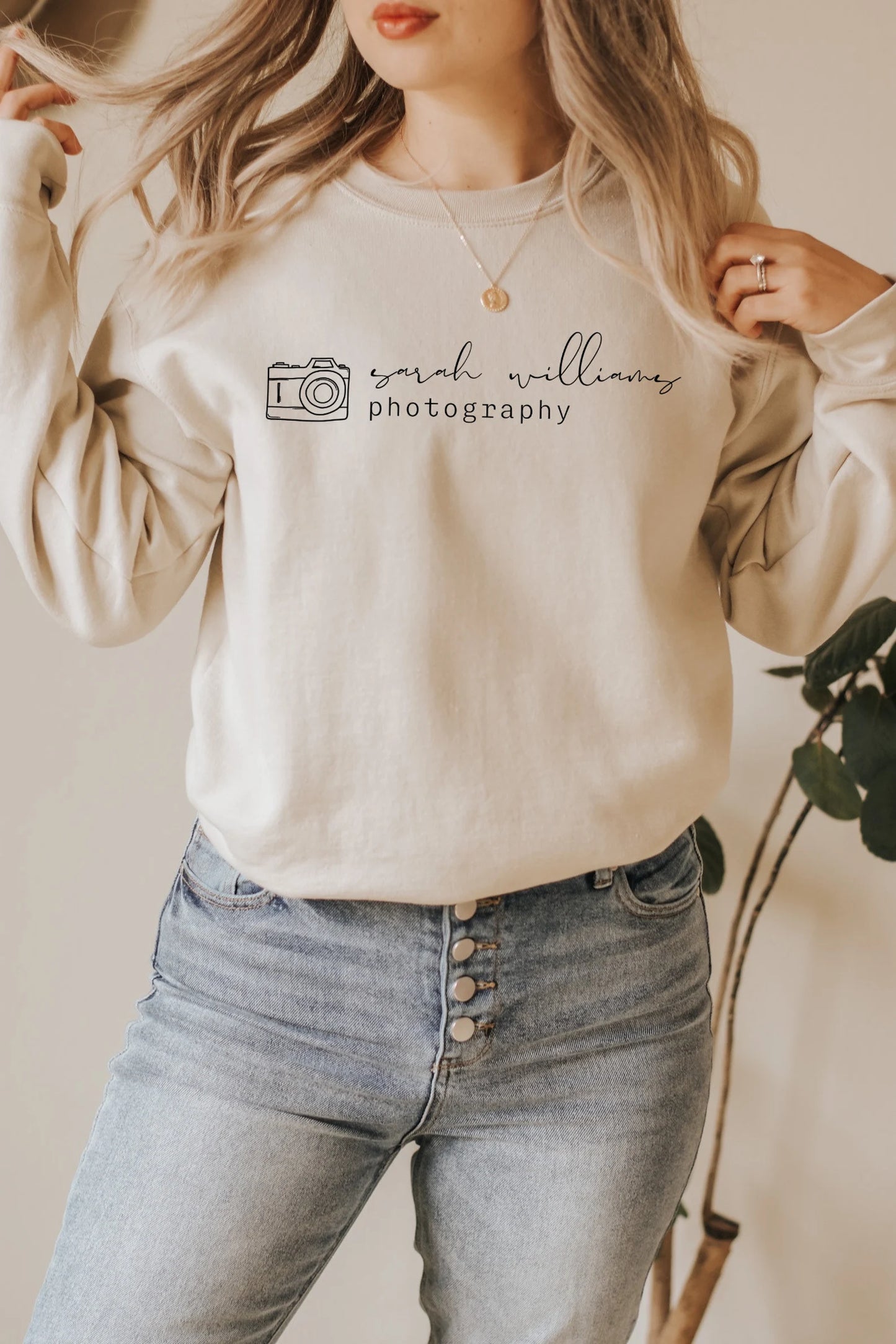 custom photographer sweatshirt with camera icon in tan