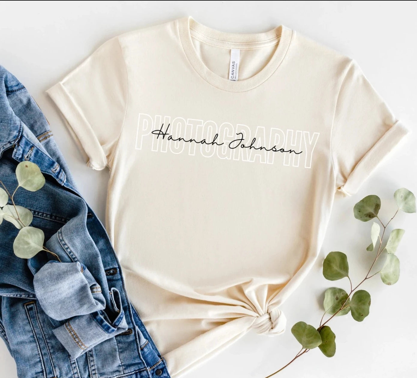 tan colored custom photographer t-shirt with block and cursive text