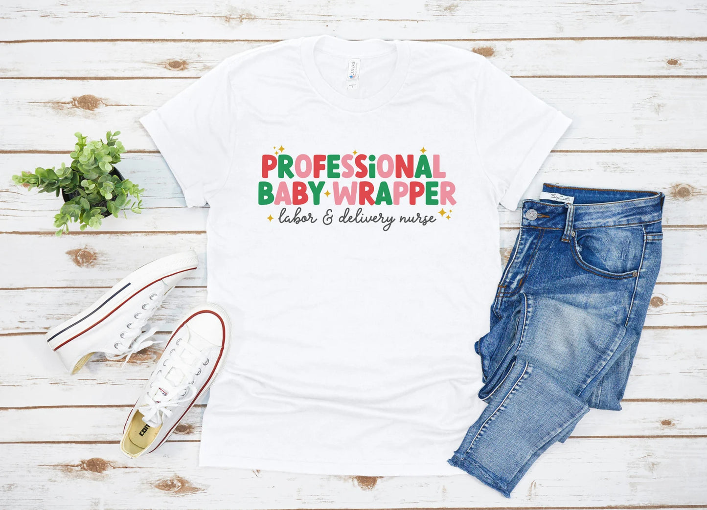 white "professional baby wrapper" t-shirt with christmas colored text