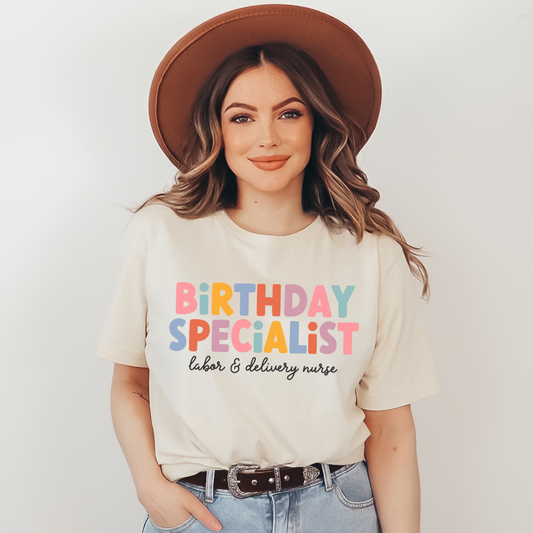 tan "birthday specialist" labor and delivery nurse t-shirt